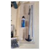 Gun cleaning supplies including Ballistol, Break-Free CLP, rods, and patches, plus assorted hardware pieces and tools