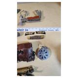 Assorted Tools and Camping Gear including Multi-Tool Ax, Knives, and Camping Accessories