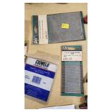 Various Welding Tools and Accessories including Magnetic Holders, Flint Lighter, and Welding Lenses