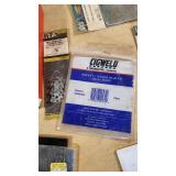 Various Welding Tools and Accessories including Magnetic Holders, Flint Lighter, and Welding Lenses