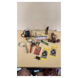 Various Automotive Accessories and Tools including Hitch Ball Mount, Tire Gauge, and Air Fresheners