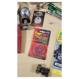 Various Automotive Accessories and Tools including Hitch Ball Mount, Tire Gauge, and Air Fresheners