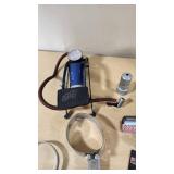 Various Automotive Accessories and Tools including Hitch Ball Mount, Tire Gauge, and Air Fresheners