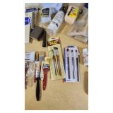 Assorted Paint and Craft Supplies including Acrylic Paint Set, Paint Brushes, Sand Paper, and Drop Cloth