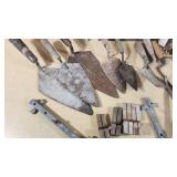 Set of Vintage Masonry Tools including Trowels, Floats, and Hammers