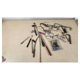 Assorted hand tools including Allen wrenches, magnetic pickup tools, and other accessories