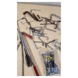 Assorted hand tools including Allen wrenches, magnetic pickup tools, and other accessories