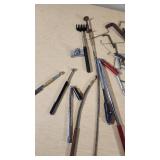 Assorted hand tools including Allen wrenches, magnetic pickup tools, and other accessories