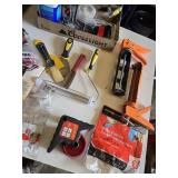 Assorted Painting and Home Improvement Tools including Brush Cleaner, Caulk Gun, and Respirator