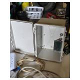 Assorted Electrical Components including APC Surge Protector, Power Strips, Extension Cords, and NEMA Enclosure