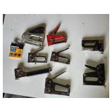 Lot of Heavy-Duty Staple Guns Including PowerShot and Bostitch Models, Assorted Staplers - Hammer Stapler Missing Slide and One of the others is as well