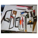 Assorted Hand Tools including Hacksaws, Hand Saws, and Measuring Tools