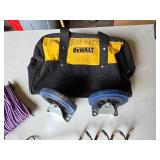 DeWalt Tool Bag and Accessories including Casters, Purple Rope, Tie Out Stake, and Small Level