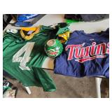 Green Bay Packers Favre #4 Jersey, Minnesota Twins Shirt, and Minnesota Wild Candle Holder