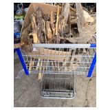 Shopping Cart full Sticks (some carved), Driftwood, and Hand Tools