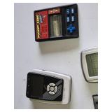 Various Vintage Electronic Gadgets Including Palm V PDA, Pocket Keno Game, and Other Handheld Devices