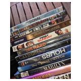 Collection of DVDs and CDs including Divergent, Spider-Man 2, and Christmas with Daniel