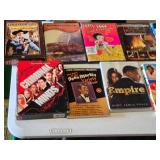 DVD and CD collection including Magnum P.I., Seinfeld, Tin Man, Burn Notice, Batman, and more