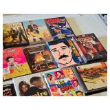 DVD and CD collection including Magnum P.I., Seinfeld, Tin Man, Burn Notice, Batman, and more