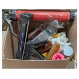 Box full of Adhesive and Caulk Guns