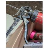 Box full of Adhesive and Caulk Guns