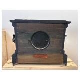 antique E. Ingraham Co. mantel clock, likely featuring a black ebonized wood case.