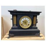 antique E. Ingraham Co. mantel clock, likely featuring a black ebonized wood case.