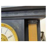 antique E. Ingraham Co. mantel clock, likely featuring a black ebonized wood case.