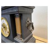 antique E. Ingraham Co. mantel clock, likely featuring a black ebonized wood case.