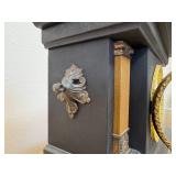 antique E. Ingraham Co. mantel clock, likely featuring a black ebonized wood case.