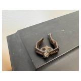 antique E. Ingraham Co. mantel clock, likely featuring a black ebonized wood case.