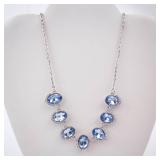 Blue Oval Crystal Necklace with Halo Setting on Silver Chain Blue Oval Crystal Necklace with Halo Setting on Silver Chain