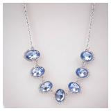 Blue Oval Crystal Necklace with Halo Setting on Silver Chain Blue Oval Crystal Necklace with Halo Setting on Silver Chain