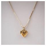 Gold-Tone Engraved Cross Heart Locket Necklace. Gold-Tone Engraved Cross Heart Locket Necklace.