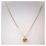 Gold-Tone Engraved Cross Heart Locket Necklace. Gold-Tone Engraved Cross Heart Locket Necklace.