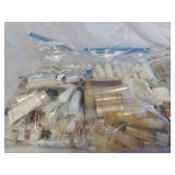 Multiple bags of soaps, conditioner and shampoos