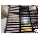 Vintage Bose speaker set with briefcase filled with cassette tapes