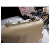 Vintage Bose speaker set with briefcase filled with cassette tapes