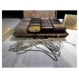 Vintage Bose speaker set with briefcase filled with cassette tapes