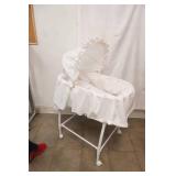 White Bassinet. In Good Condition. On Wheels