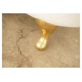 Fiberglass Slipper Clawfoot bathtub featuring polished gold-toned feet and brass hardware.