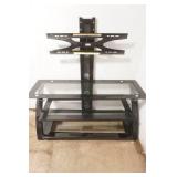 TV Stand. black metal frame, tempered glass shelves, integrated swivel mount for flat screen TV. 50"x 21"x 52"