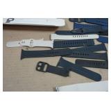 Asssortment of Apple Watch Bands and Charger