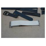 Asssortment of Apple Watch Bands and Charger