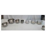 Assorted vintage stainless steel mixing bowls. Some with covers.