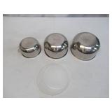 Assorted vintage stainless steel mixing bowls. Some with covers.