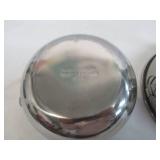 Assorted vintage stainless steel mixing bowls. Some with covers.