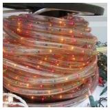 Lot of Christmas Decorating Items:9 ft. lighted Xmas Tree in box, Christmas tree stands, Storage bag and many lighting cords