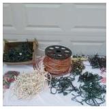 Lot of Christmas Decorating Items:9 ft. lighted Xmas Tree in box, Christmas tree stands, Storage bag and many lighting cords