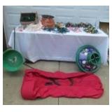 Lot of Christmas Decorating Items:9 ft. lighted Xmas Tree in box, Christmas tree stands, Storage bag and many lighting cords